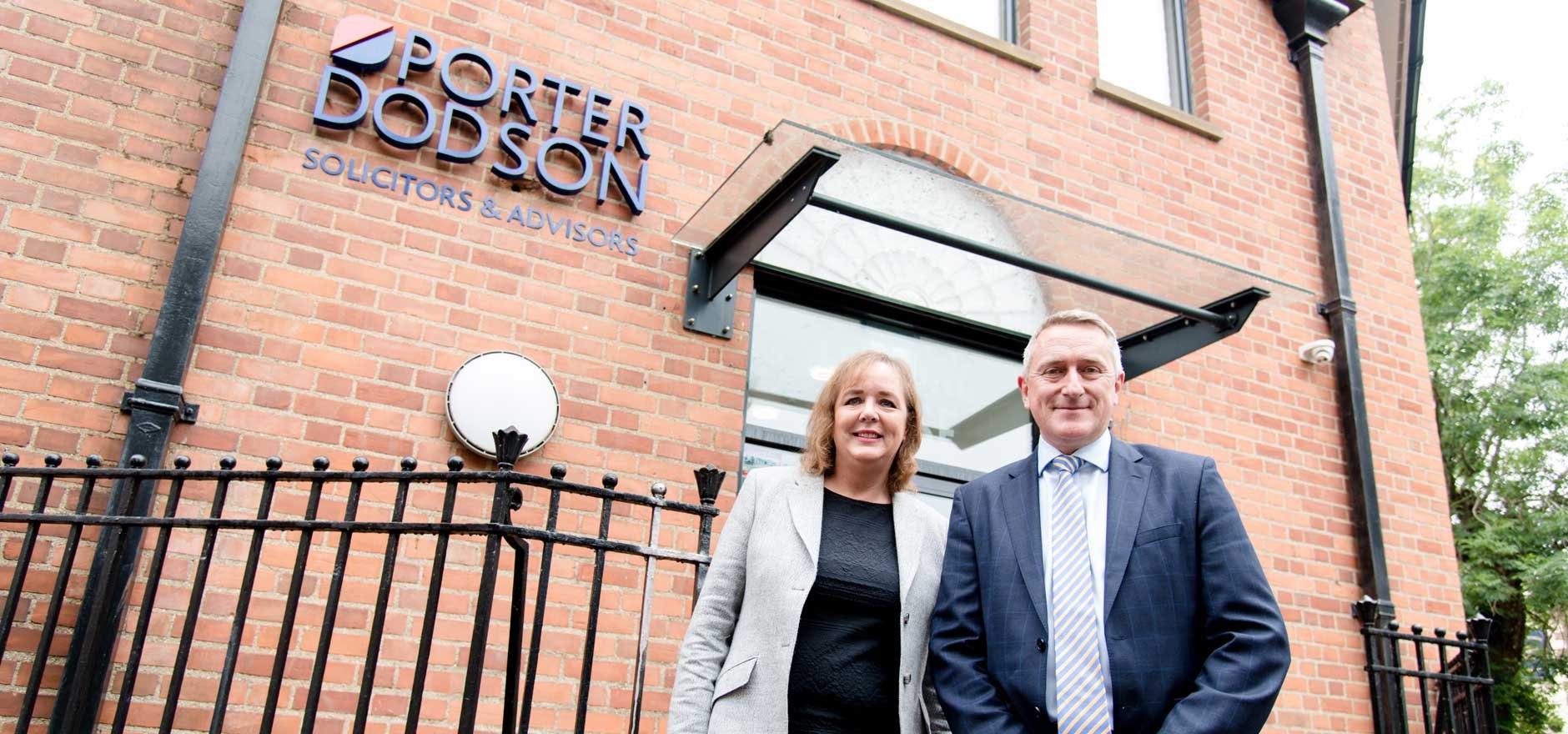 Deborah Carrington and Robert Fox outside the Yeovil office entrance