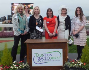 Partner Lesley Gaskell and Solicitor Elizabeth York with guests at the winners podium